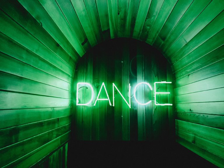brown door with Dance neon lights